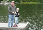 Father and Son Fishing off Dock
